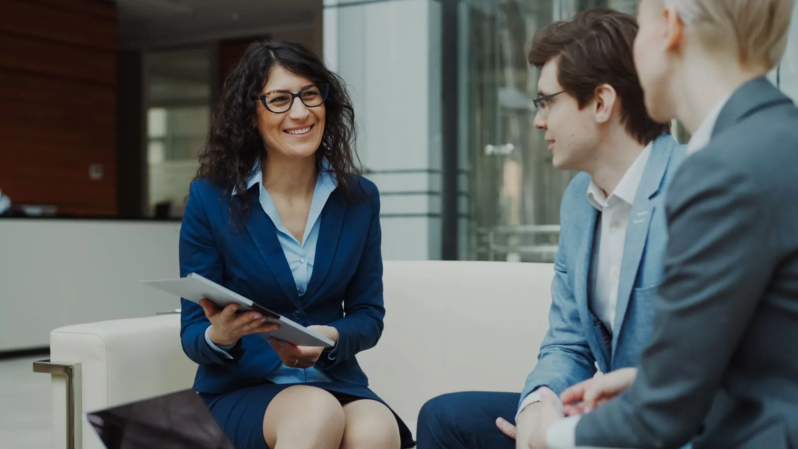 Two advisors reviewing a strategy document at an office table
